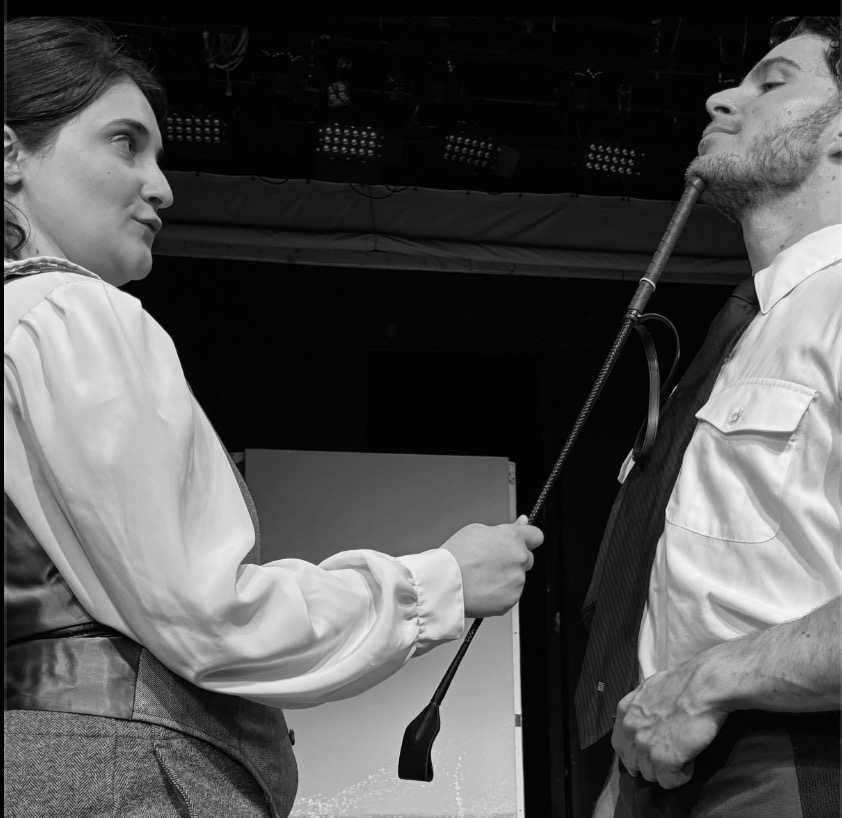 Black and white scene with riding crop